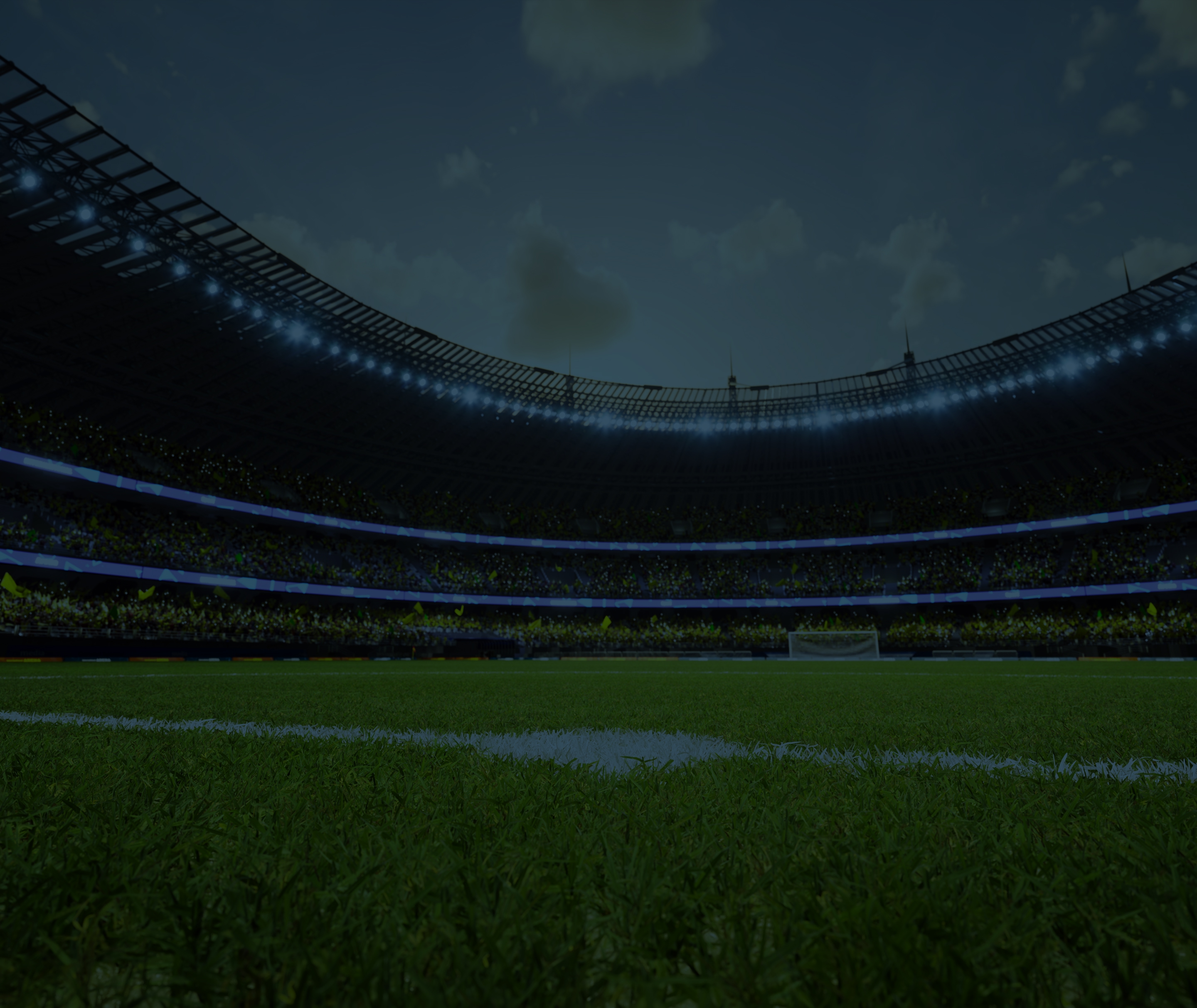 Empty soccer stadium at night with illuminated stands and goalpost in the distance.